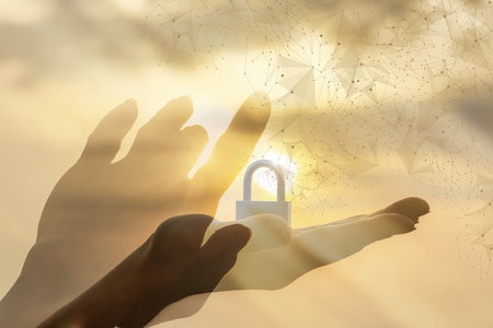 The concept of digital security and data protection. The key moment of human interaction with a digital system and the installation of protection.の写真素材