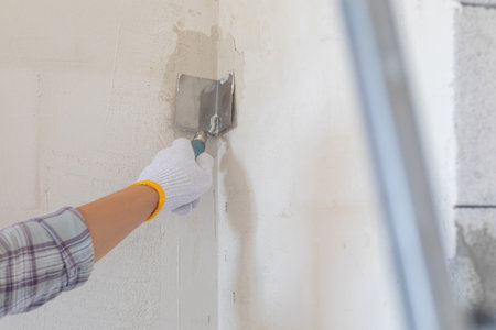 Aligning corners in walls with a spatula. The concept of molar work.の写真素材