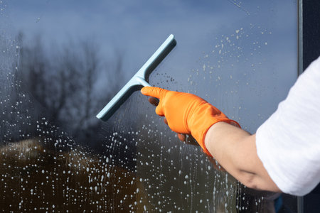 Cleanliness and care of windows. The concept of window washing service.の写真素材