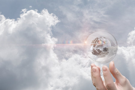 The future in the palm of your hand. The concept of global influence and responsibility of humanity's potential in shaping the future of the planet.の写真素材