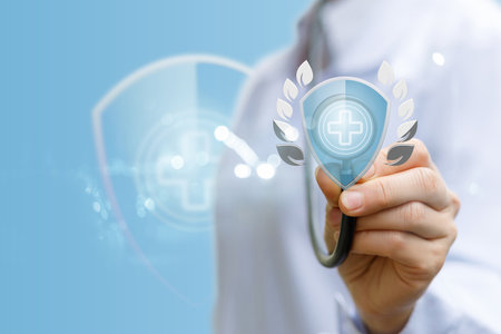A professional in a white coat is using a virtual interface to create a healthcare emblem.の写真素材