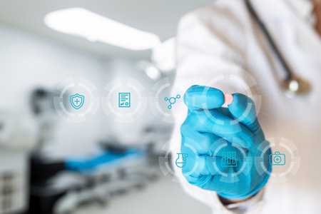 A healthcare professional in gloves displays a tablet while interacting with a virtual screen filled with medical icons. This showcases innovation in medical technology and patient care.の写真素材