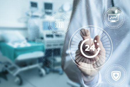 A healthcare professional interacts with a digital interface featuring monitoring icons, emphasizing 24-hour patient care. The background shows a hospital setting with medical equipment.の写真素材