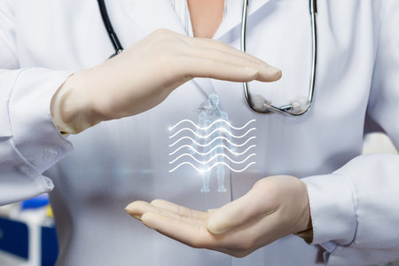 A healthcare professional in a white coat and gloves showcases a holographic representation of a human figure surrounded by wave patterns. This innovative technology enhances patient care.の写真素材
