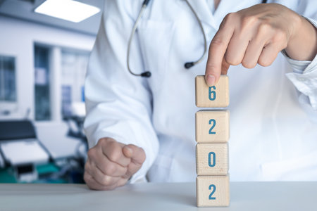 Health professional arranging wooden blocks with numbers indoors. A medical expert is focused on...