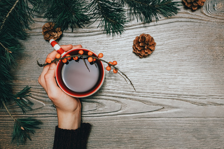 Warm Christmas tea on a wooden tableの写真素材