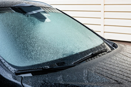 Frozen front car window in winter.