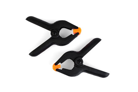 Plastic clamps for woodworking on white background.