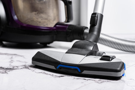 Vacuum cleaner full of garbage after home cleaning.