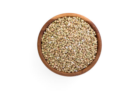 Green buckwheat in wooden bowl isolated on white background.の写真素材