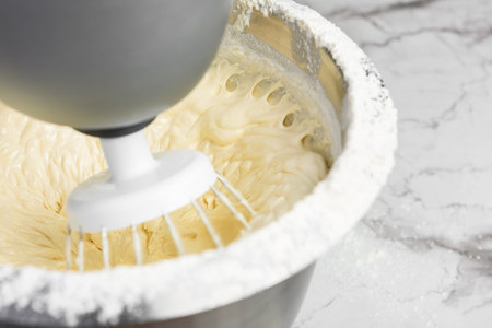 Mixing biscuit dough with an electric mixer.