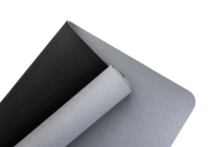 Gray fitness or yoga mat isolated on white background.の写真素材