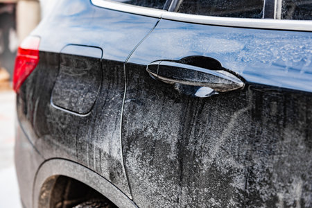 Close up of a dirty salty car in winter.の写真素材
