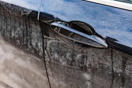 Close up of a dirty salty car in winter.の写真素材