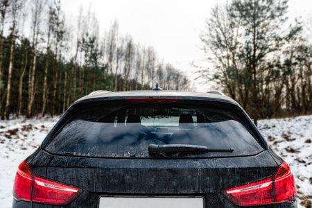 Dirty rear car window in winter.の写真素材