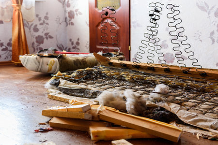 Getting rid of old things. Disassembling an old sofa in the attic.の写真素材
