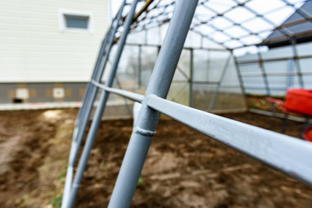 Repair or renovation of old greenhouse on spring day.の写真素材