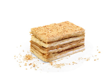 Slice of honey cake isolated on white background.