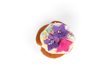 Delicious cupcake with white cream and sprinkles isolated on white background