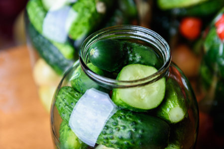 Preservation of season vegetables. Preparation vegetables in jars and ingredients for canned food, cooking process.の写真素材