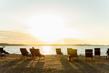 Sandy beach for swimming and sunbathing with changing rooms and deck chairs in Belarusの写真素材
