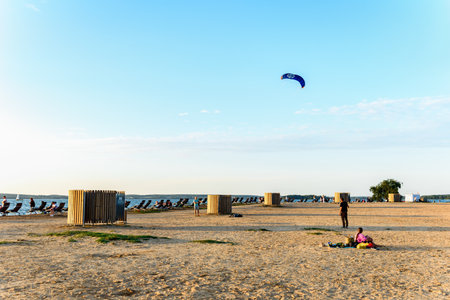 Sandy beach for swimming and sunbathing with changing rooms and deck chairs in Belarusの写真素材