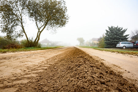 Grading of a dirt road in late autumnの写真素材