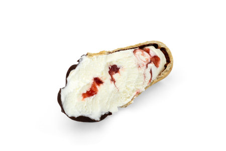Ice cream with strawberry jam in a waffle cup isolated on white background.