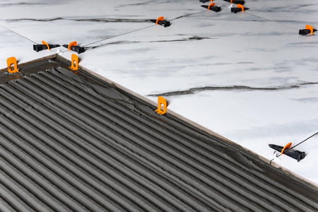 Installing the tiling system (clips) before laying tiles