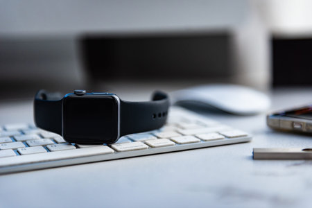 Hand putting on charging smart watch for wireless charging