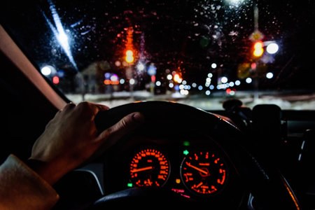 Driving a modern car in the city in evening night time