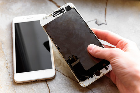Replacing the broken screen and phone display with a new screen.