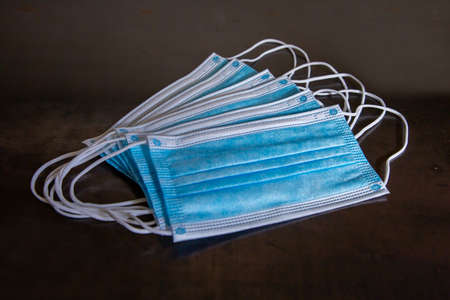 A set of blue medical masks. Close-up of medical masks. Coronavirus protection.