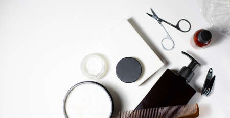 Hygiene accessories. Men's cosmetics. Cosmetology care items. Soap, cream, comb, shampoo, scissors. Free space for text.の写真素材