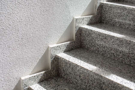 Fragment of a gray granite staircase in the building.の写真素材