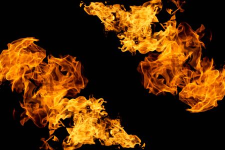Fire on black background. Fiery patterns. Burning flame. Blazing fire. Flaming patterns and abstract smoke. Concept, idea, project. の写真素材