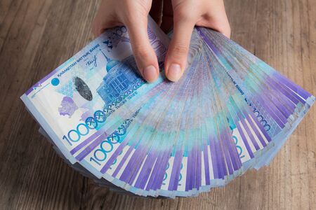 Hands hold a lot of money. Tenge KZT. National currency of Kazakhstan, KZ. Exchange rate. Economy, development, business, Bank, broker. Banknoteの写真素材