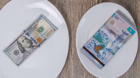 The exchange rate between the US dollar and the Kazakhstan tenge. The economy, the Bank, the external debt, the national debt. International relations. Foreign currency. Crisis, inflation, businessの写真素材