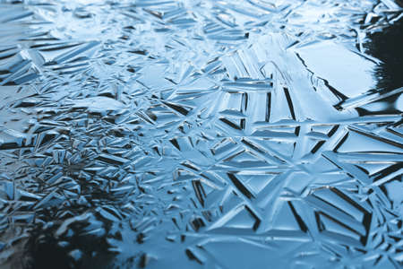 Ice pattern on the water. Awesome ice background. Background with empty space for text or image....
