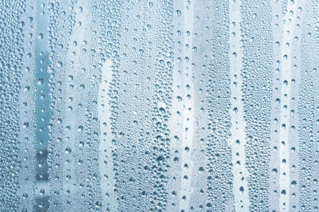 A small raindrop rests on the glass after rain. Raindrops On The Glass. Raindrops on the window....
