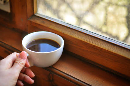 Brewed coffee cup on brown backgroundの写真素材