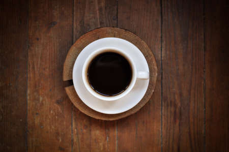 Brewed coffee cup on brown backgroundの写真素材