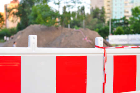 Warning stripped fence outside no entryの写真素材