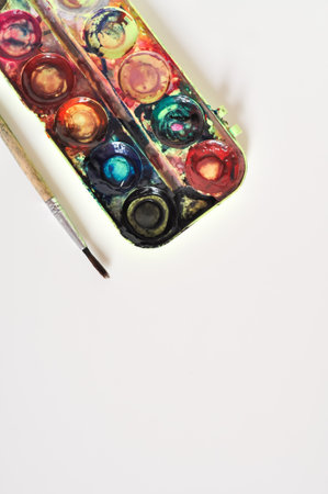 old paint and brush for painting on white background.preschool education for childrenの写真素材