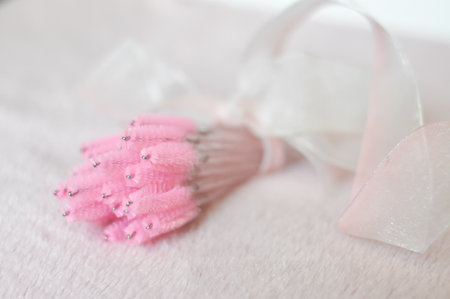 Pink brushes for eyelash extensions and brows in beauty salon