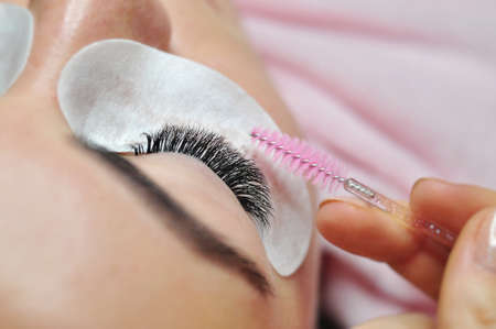 Lash extensions in beauty salon macro eye top viewの写真素材