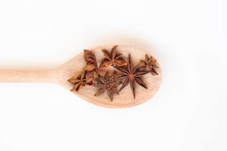 Cinnamon sticks and anise stars on the wooden spoon.asian spicesの写真素材