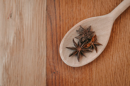 Cinnamon sticks and anise stars on the wooden spoon.asian spicesの写真素材