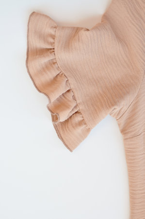 Part of baige puffy dress details macro . High quality photoの写真素材
