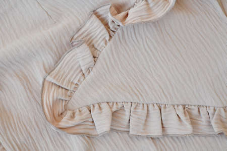 Part of baige puffy dress details macro . High quality photoの写真素材